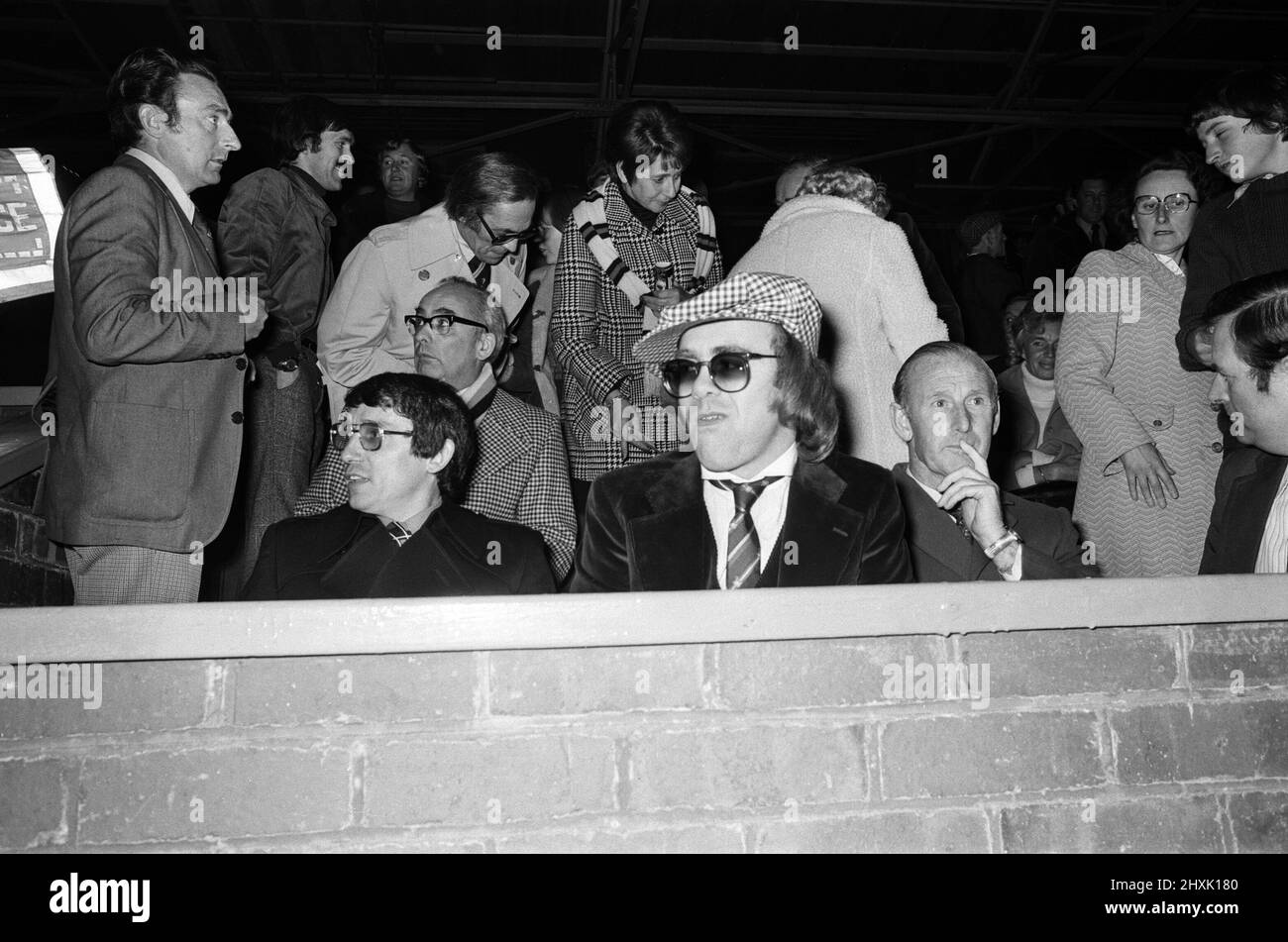 Graham Taylor and Elton John watching the football match, West Bromwich Albion v Watford.  25 October 1977. Stock Photo