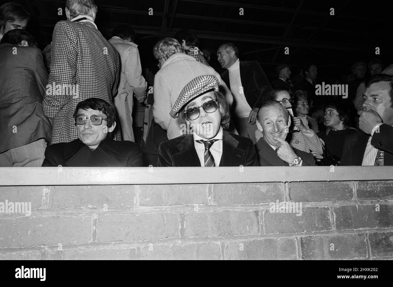 Graham Taylor and Elton John watching the football match, West Bromwich Albion v Watford.  25 October 1977. Stock Photo