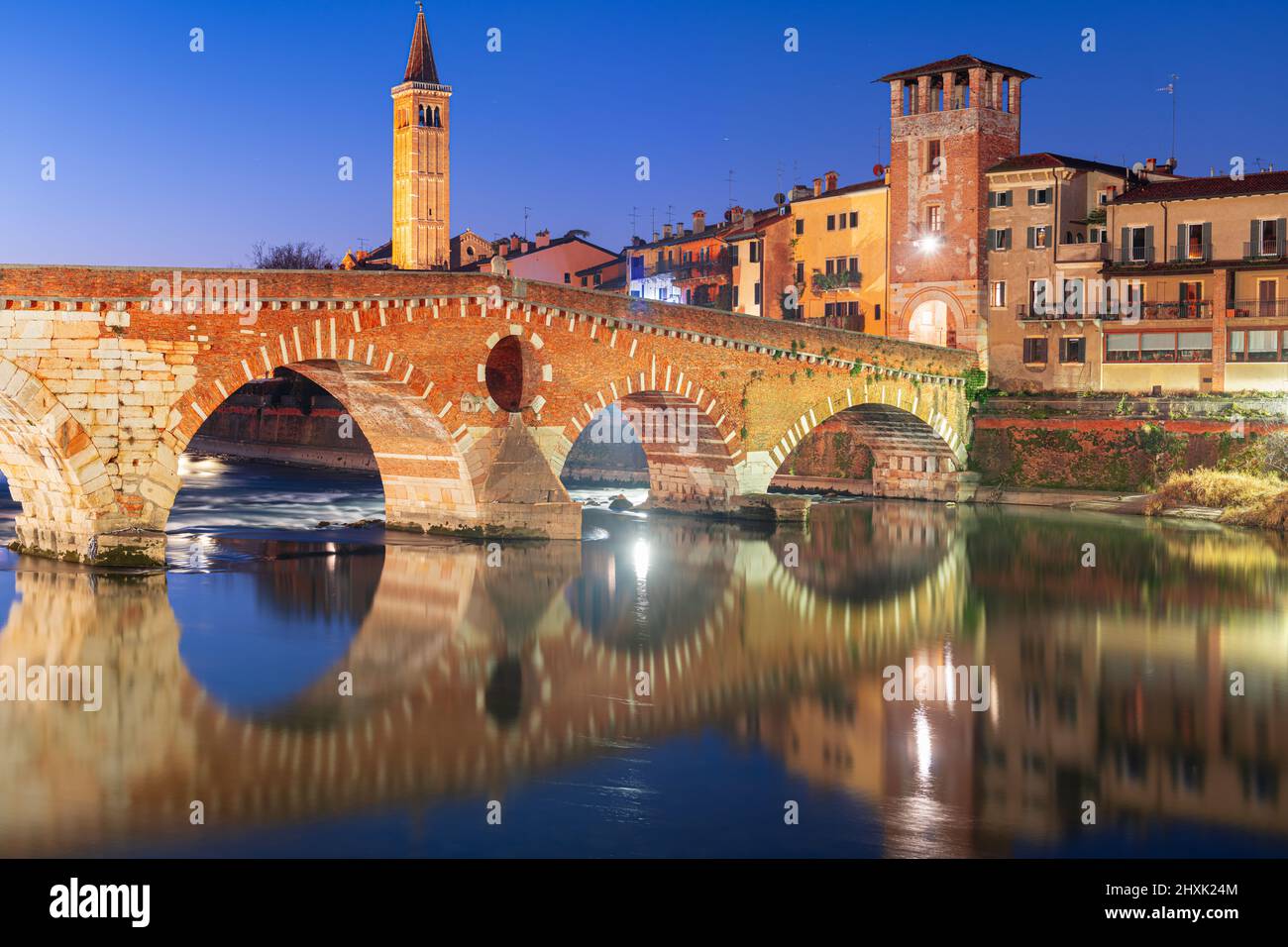 Verona, Italy Town Skyline on the Adige River with Ponte Pietra at night. Stock Photo