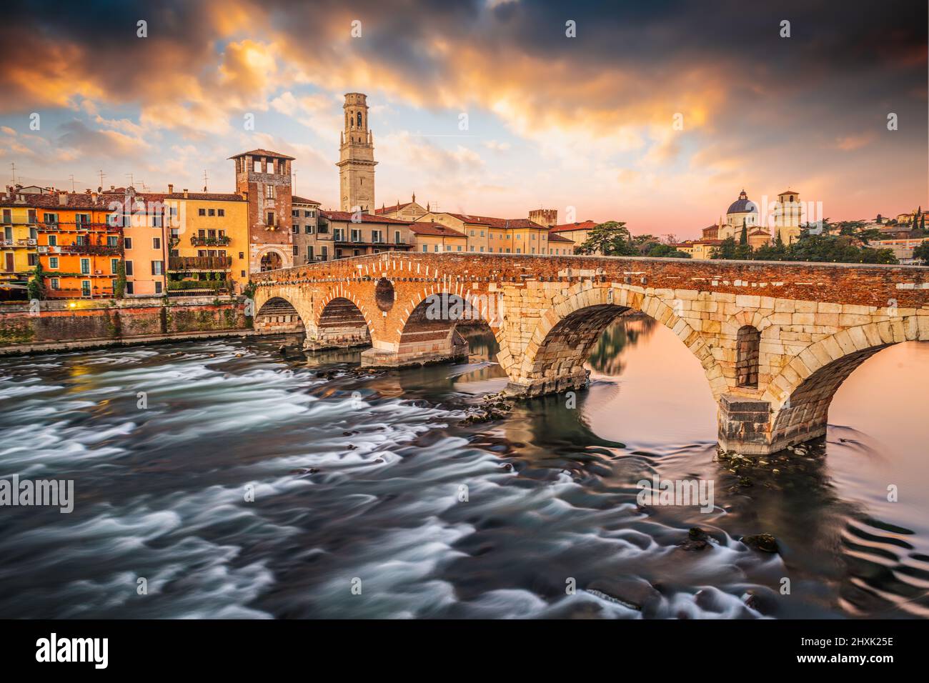 Verona, Italy Town Skyline on the Adige River with Ponte Pietra at dawn. Stock Photo