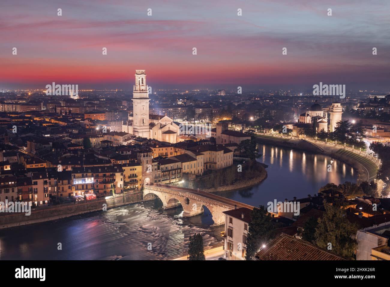 Verona, Italy town skyline on the Adige River at dusk. Stock Photo