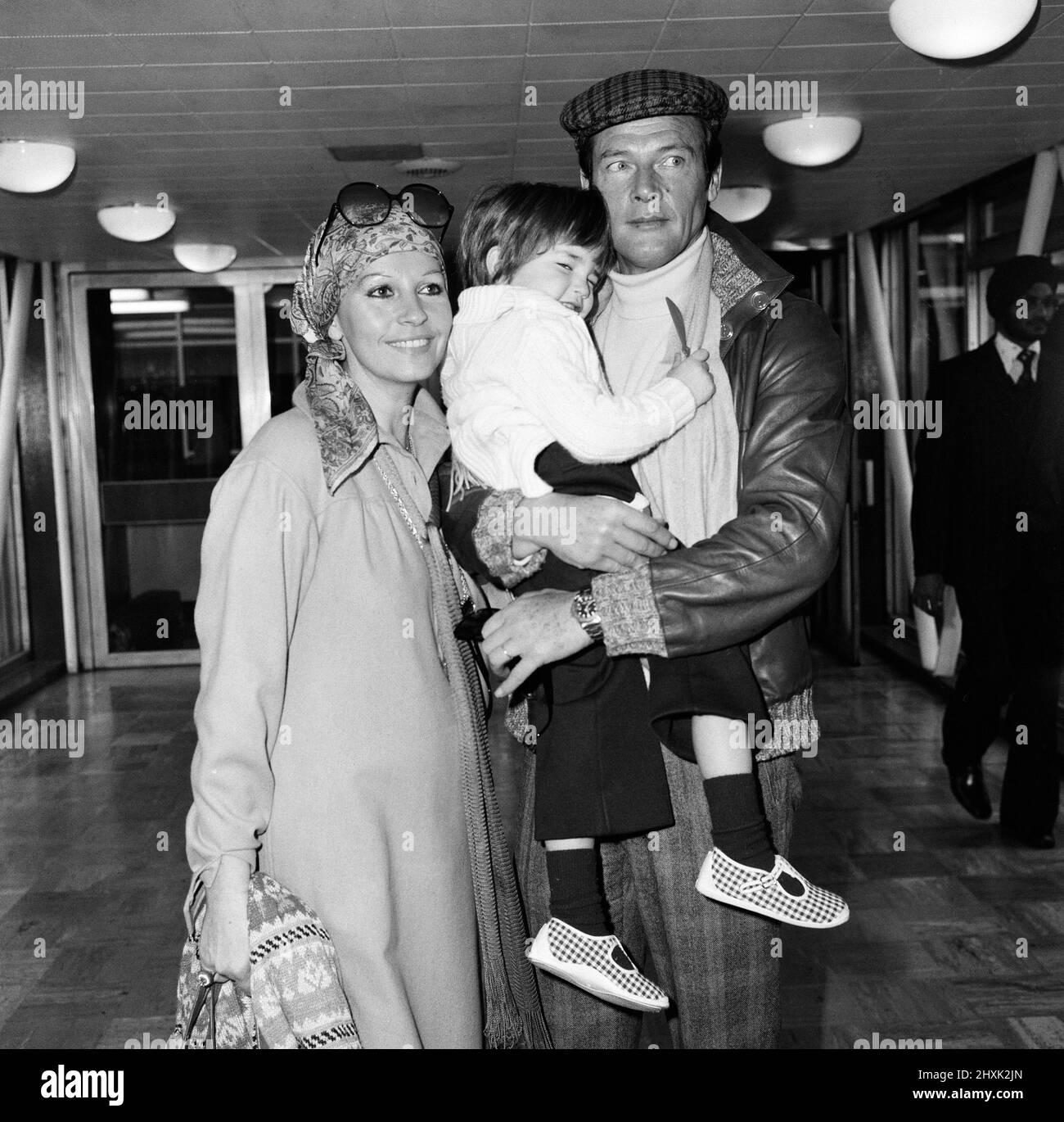 Roger Moore, off to Los Angeles from Heathrow Airport, is planning to a make a comedy film in Hollywood. He left London with his wife Luisa and their 3-year-old son Christian to promote his latest picture 'The Spy Who Loved Me'. 1st March 1977. Stock Photo