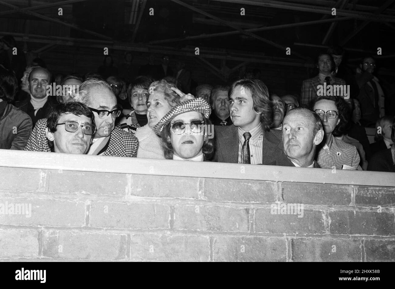 Elton John watching the football match, West Bromwich Albion v Watford. Final score 1-0 to West Bromwich Albion. League Cup 3rd round. 25th October 1977. Stock Photo