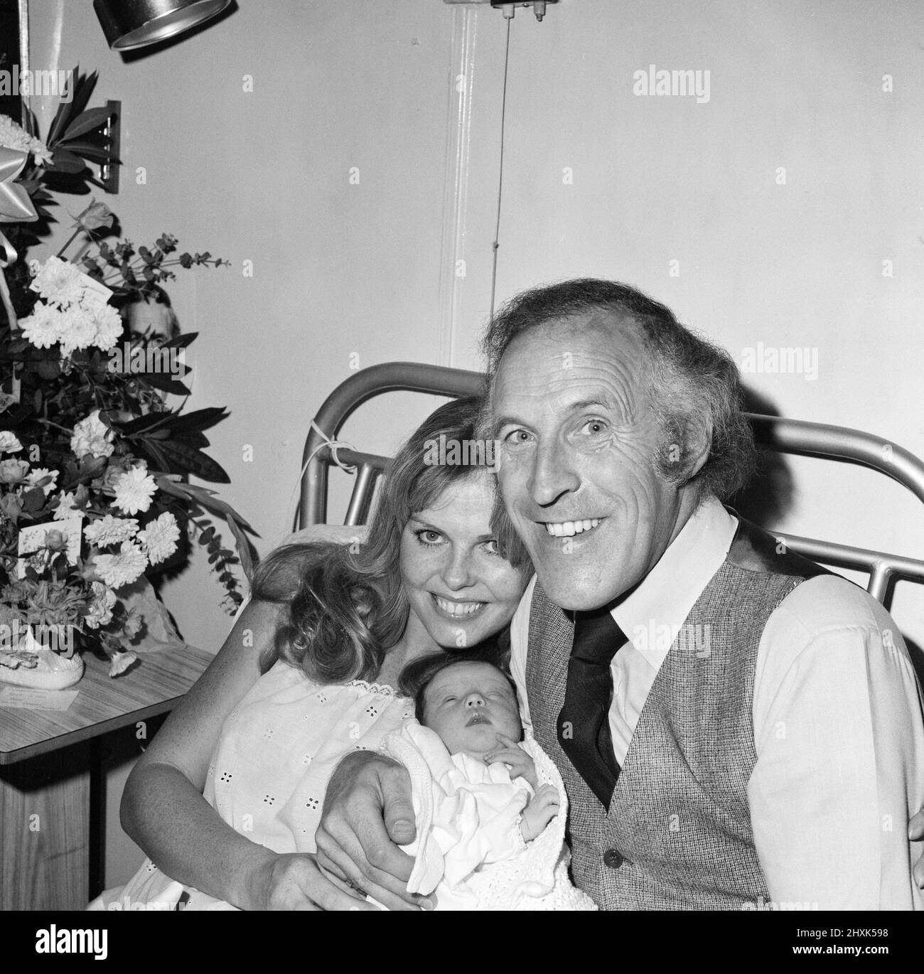 Bruce Forsyth pictured with his wife Anthea Redfern after she gave birth to their first child. The 6 1/2lb baby girl will be called Louisa. Pictures were taken at the Avenue Clinic, London. 8th November 1977. Stock Photo