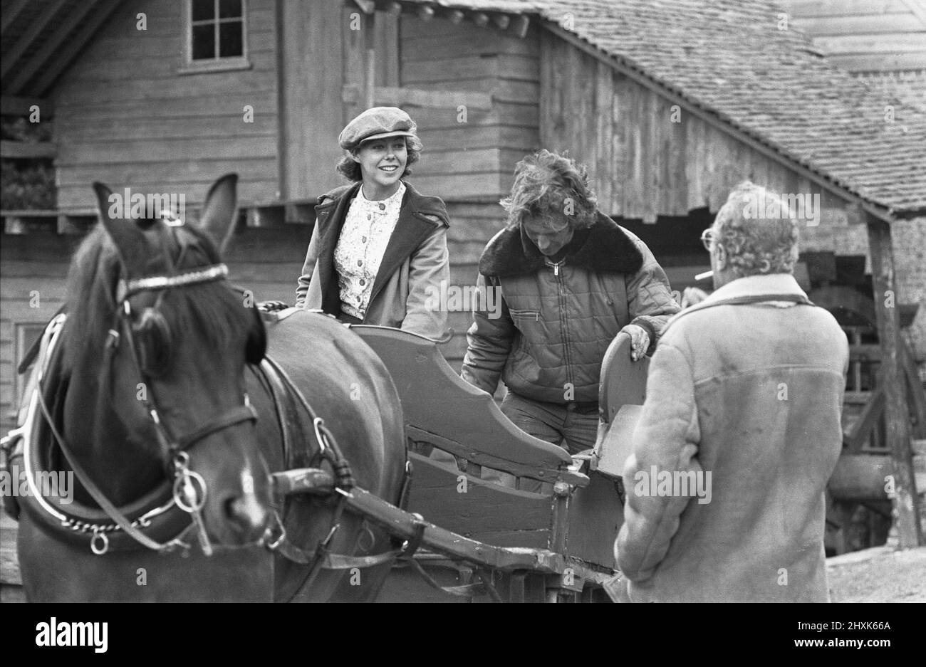 Director John Sturges (right) seen here with  actress Jenny Agutter during location filming for The Eagle Has Landed at Mapledurham 14th June 1976 Stock Photo