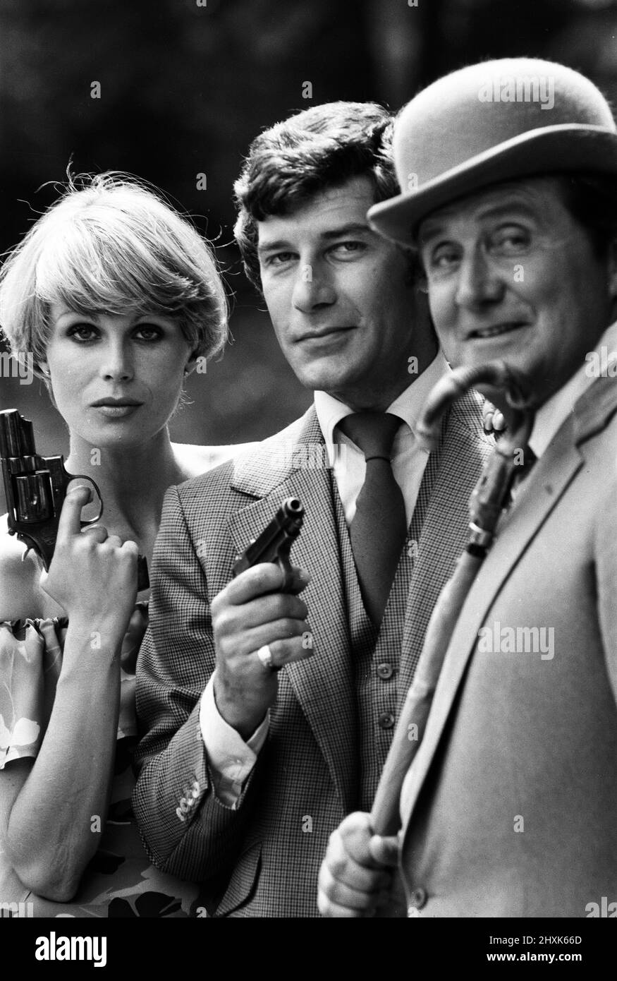 The Avengers will be coming back to the TV screen shortly, with a new leading lady in the form of lovely Joanna Lumley. Another new face will be that of Gareth Hunt, who will co-star with Joanna. Star of the series will be - as usual - Patrick Macnee who plays the stalwart John Steed. The trio are pictured ahead of the new series. 12th July 1976. Stock Photo