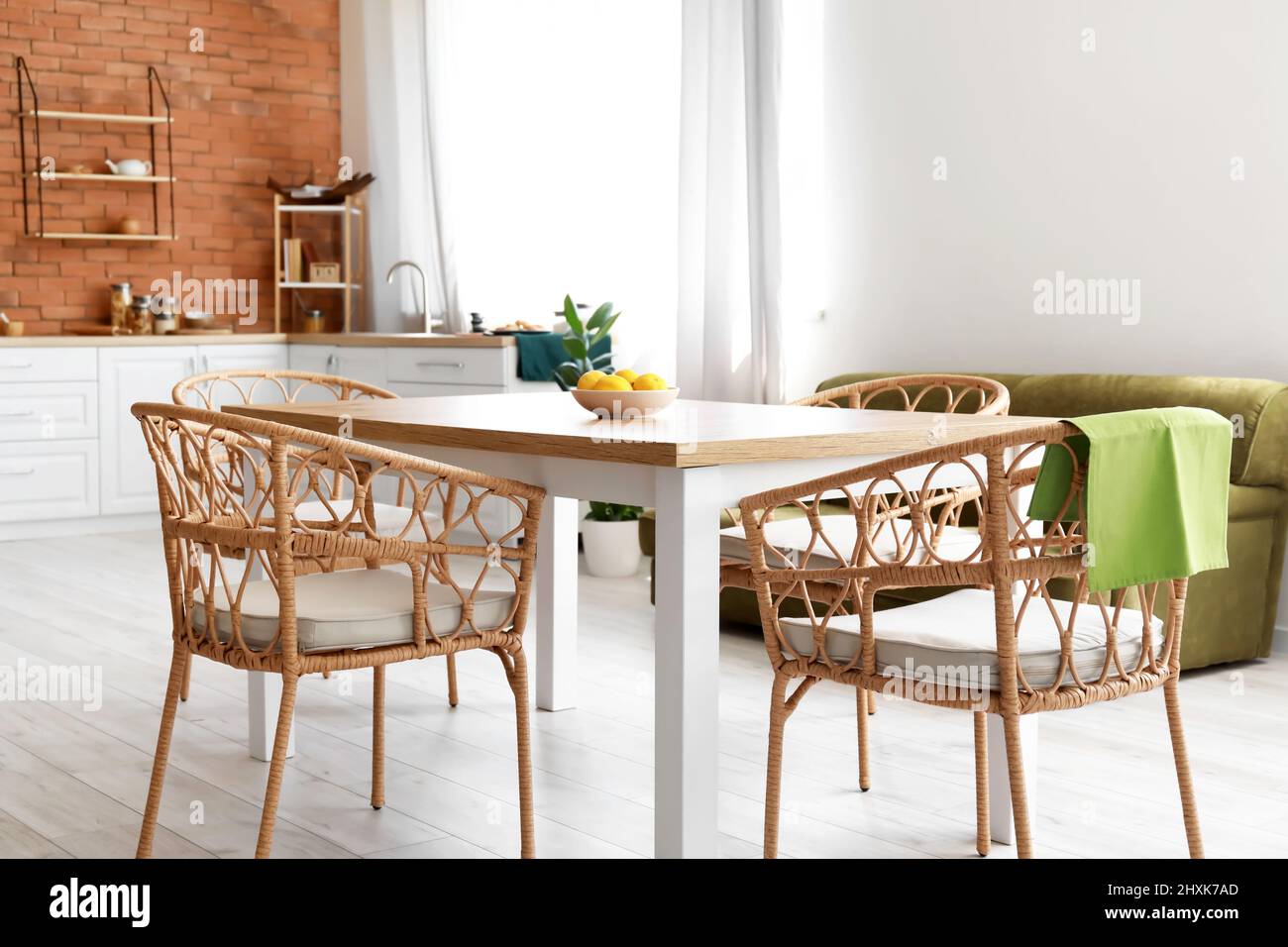 Dining table and chairs in modern kitchen interior Stock Photo - Alamy