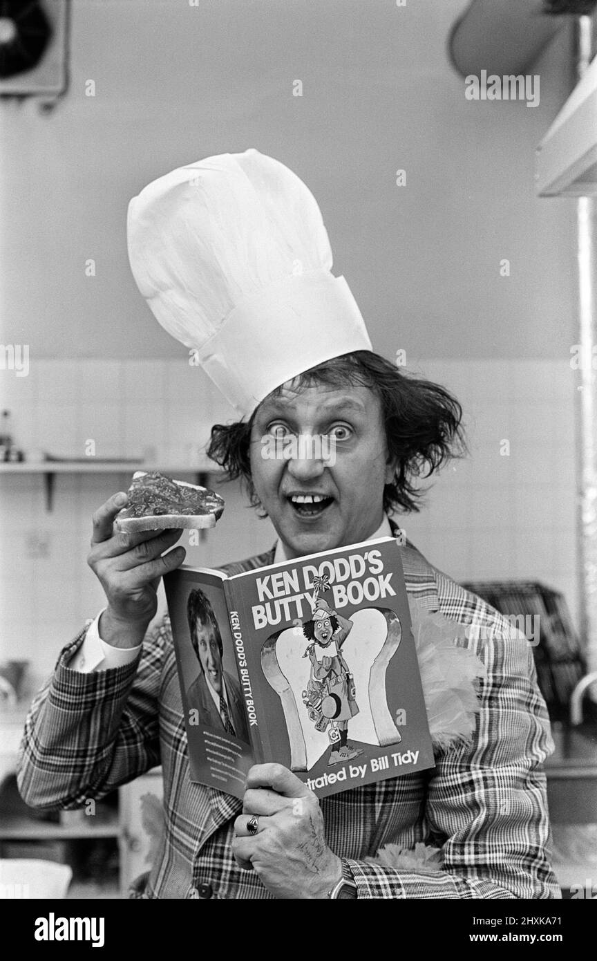 Ken Dodd with a jam butty and the butty book. 15th October 1977 Stock