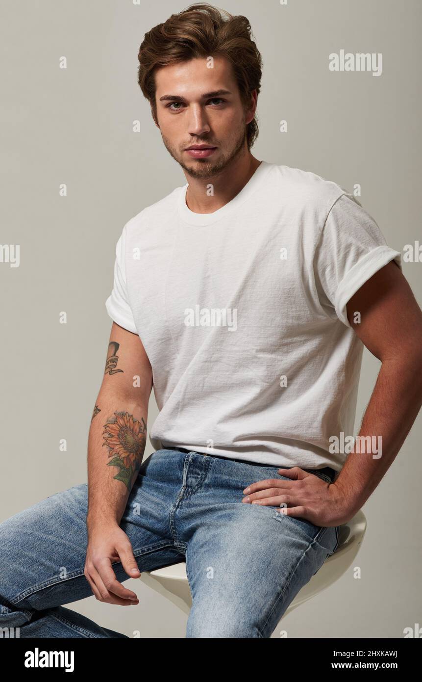 Fashion male model wearing t shirt hires stock photography and images