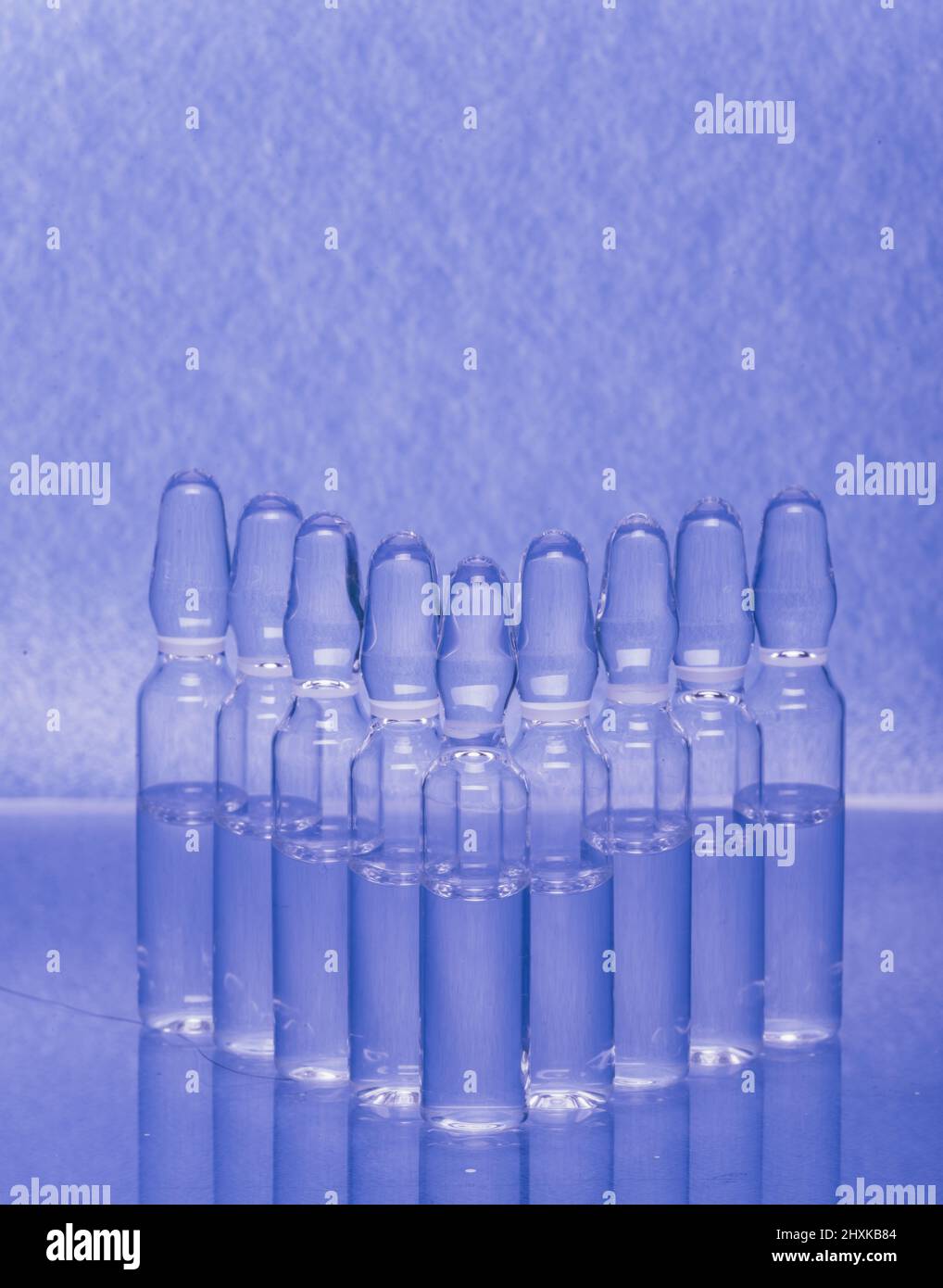 Glass medical ampoule vial for injection. Medicine is liquid sodium