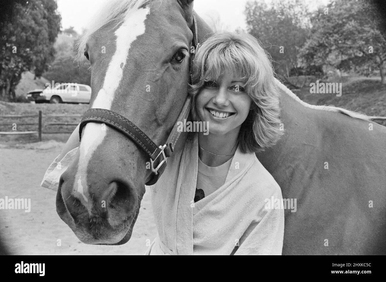 Olivia Newton John, singer and actor, pictured at home in Malibu, California, America.Pictured here with her horse.   Picture taken 25th July 1976 Stock Photo