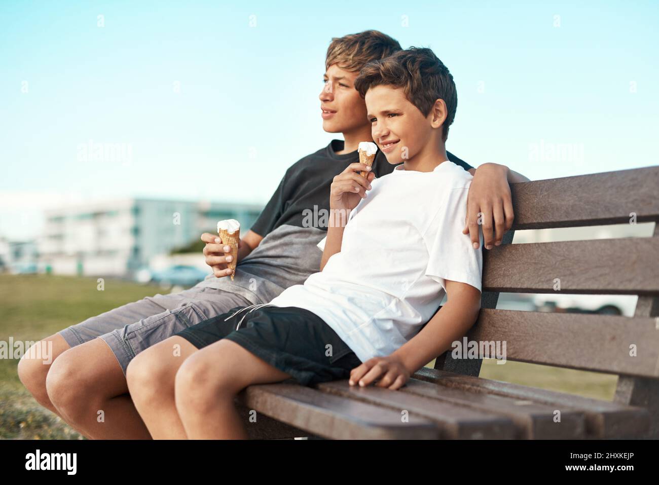 You cant be sad when youre eating icecream. Shot of two happy brothers