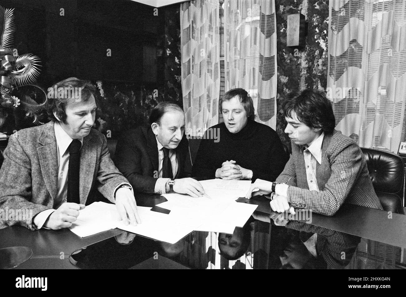 Tim Rice, has written a new Opera with Andrew Lloyd Webber based on Eva Peron.Picture shows Tim and Andrew and the business team.  Picture shows Left to Right : Roy Featherstone (boss of MCA Records) David Land (business manager) Tim Rice (Sir Time Rice) Andrew Lloyd Webber (Sit Andrew Lloyd Webber)  Evita is a musical with music by Andrew Lloyd Webber and lyrics by Tim Rice. It concentrates on the life of Argentine political leader Eva Per¿, the second wife of Argentine president Juan Per¿. The story follows Evita's early life, rise to power, charity work, and eventual death.  See other pictu Stock Photo