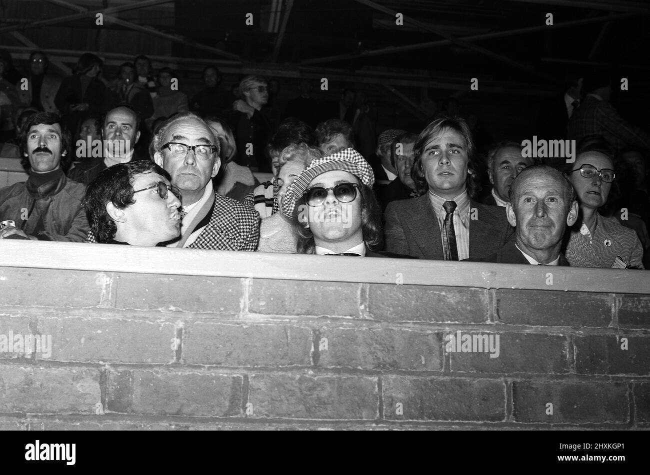 Elton John watching the football match, West Bromwich Albion v Watford. Final score 1-0 to West Bromwich Albion. League Cup 3rd round. 25th October 1977. Stock Photo