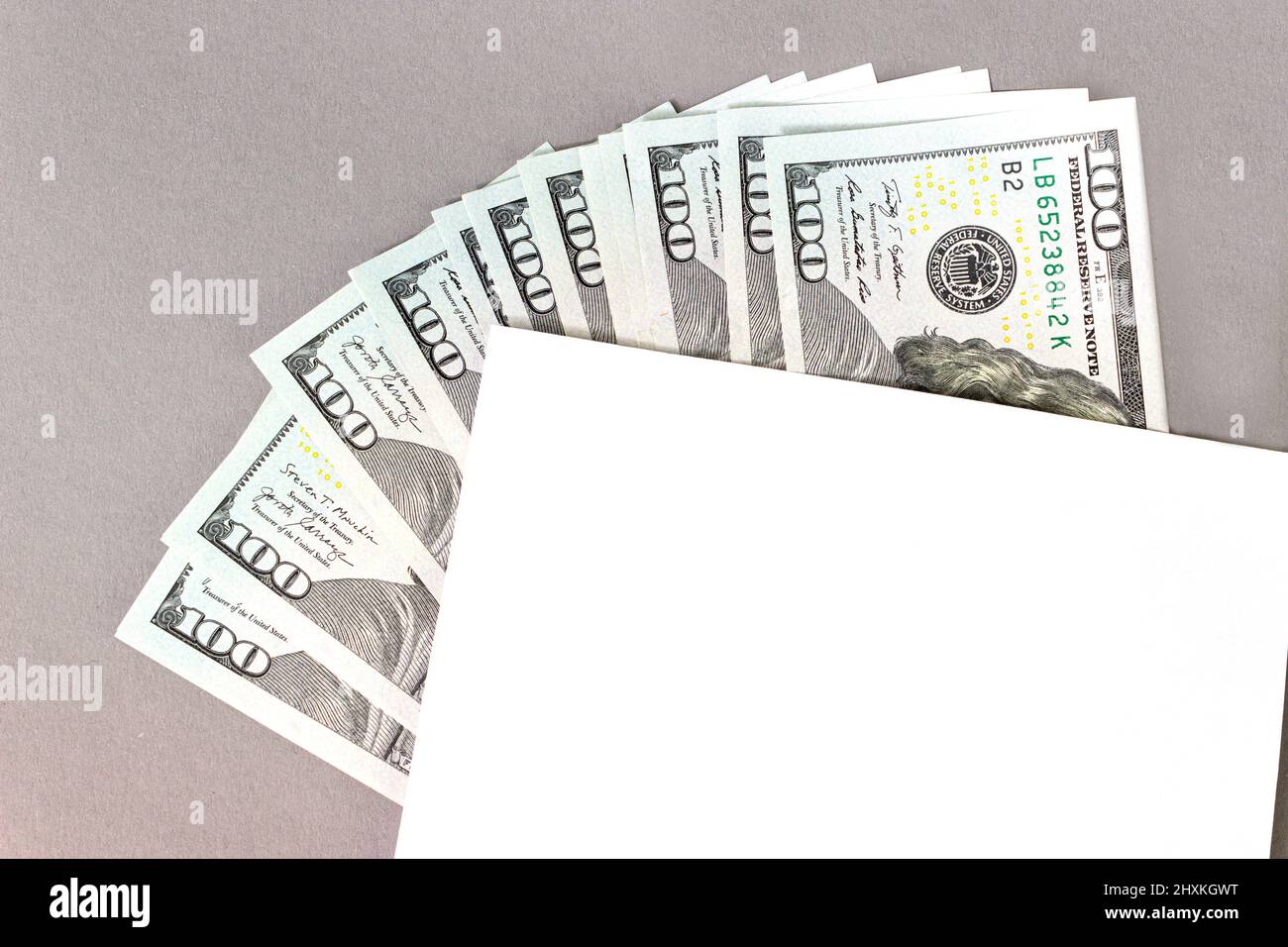 Part of paper sheet on US Currency One Hundred Dollar Bills arranged in