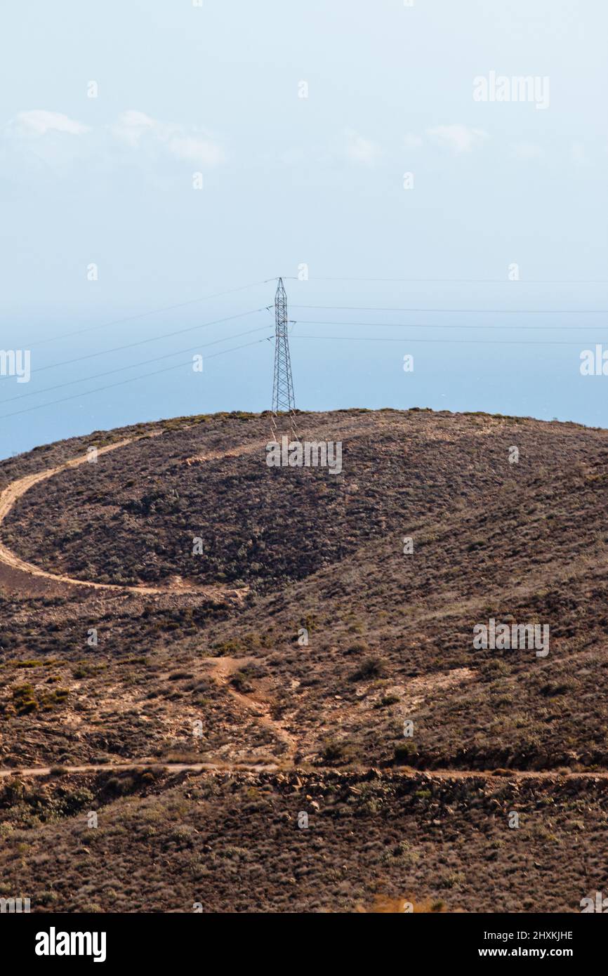 Lone high voltage power line in the mountains Stock Photo - Alamy