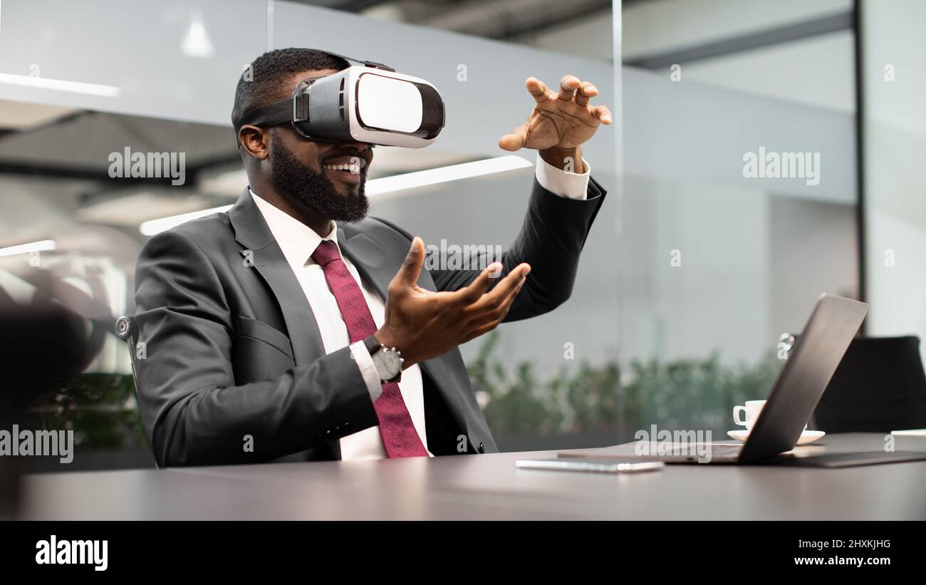 Black businessman testing new technologies for business Stock Photo