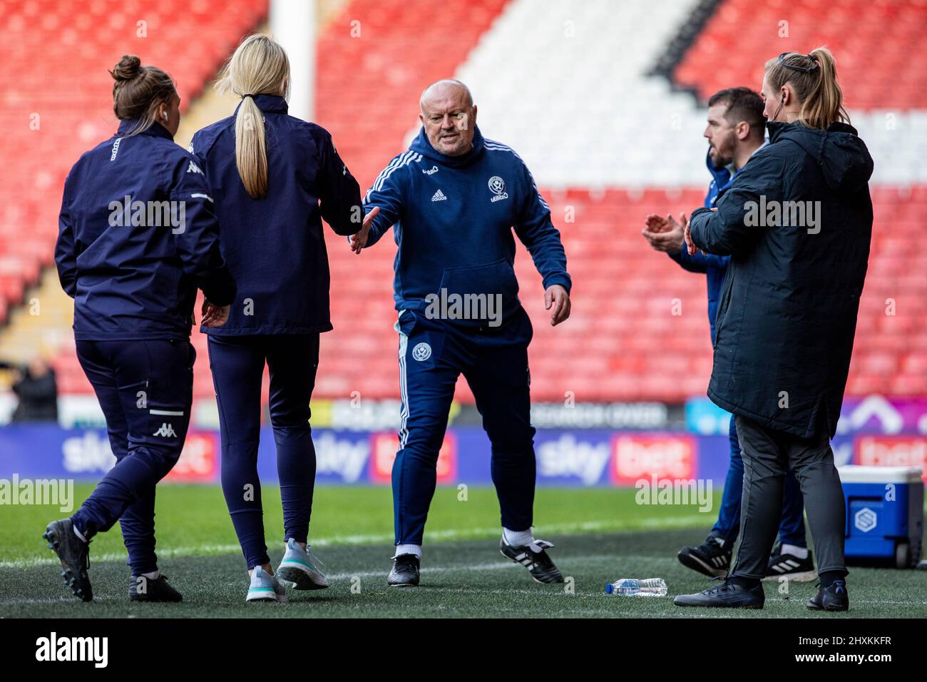 Managers shake hands after the final whistle during the FA Women's ...