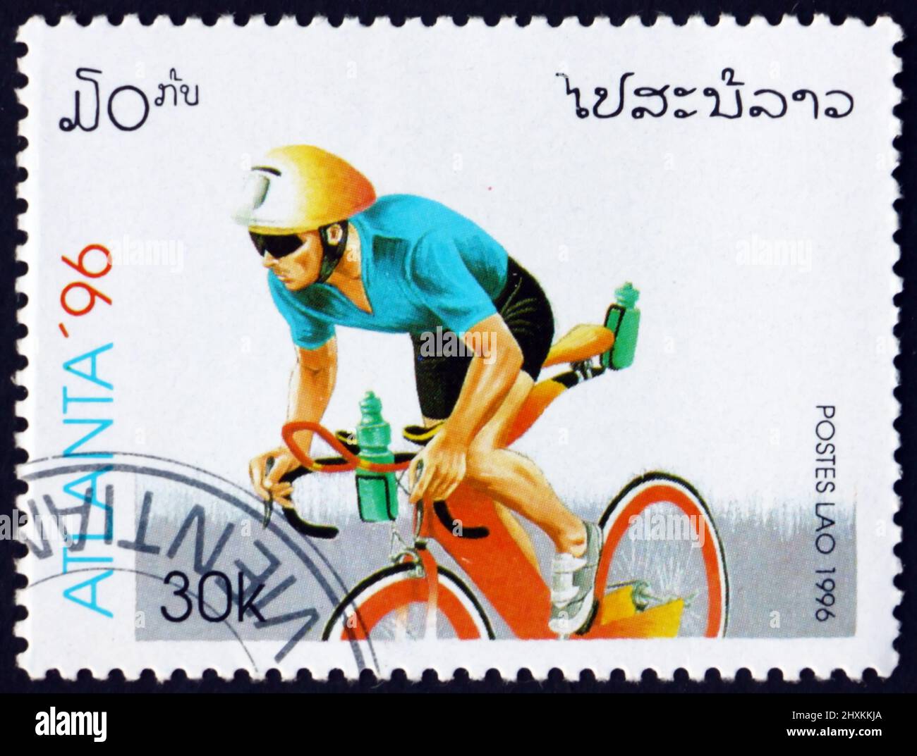 LAOS - CIRCA 1996: a stamp printed in Laos shows cycling, 1996 Summer Olympics, Atlanta, circa 1996 Stock Photo