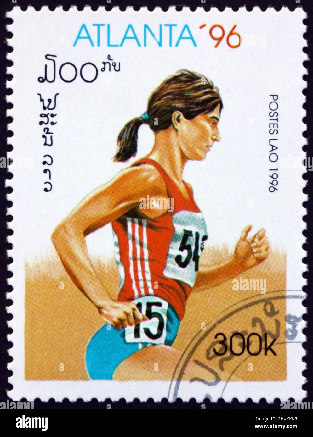 LAOS - CIRCA 1996: a stamp printed in Laos shows running, 1996 Summer Olympics, Atlanta, circa 1996 Stock Photo