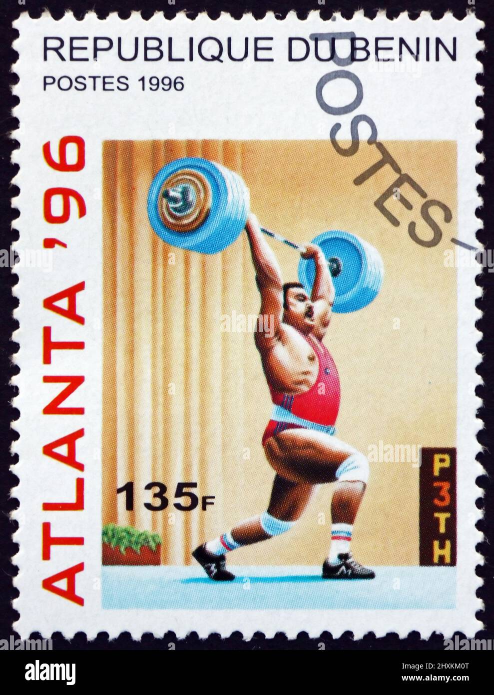 BENIN - CIRCA 1996: a stamp printed in Benin shows weight lifting, 1996 Summer Olympic Games, Atlanta, circa 1996 Stock Photo
