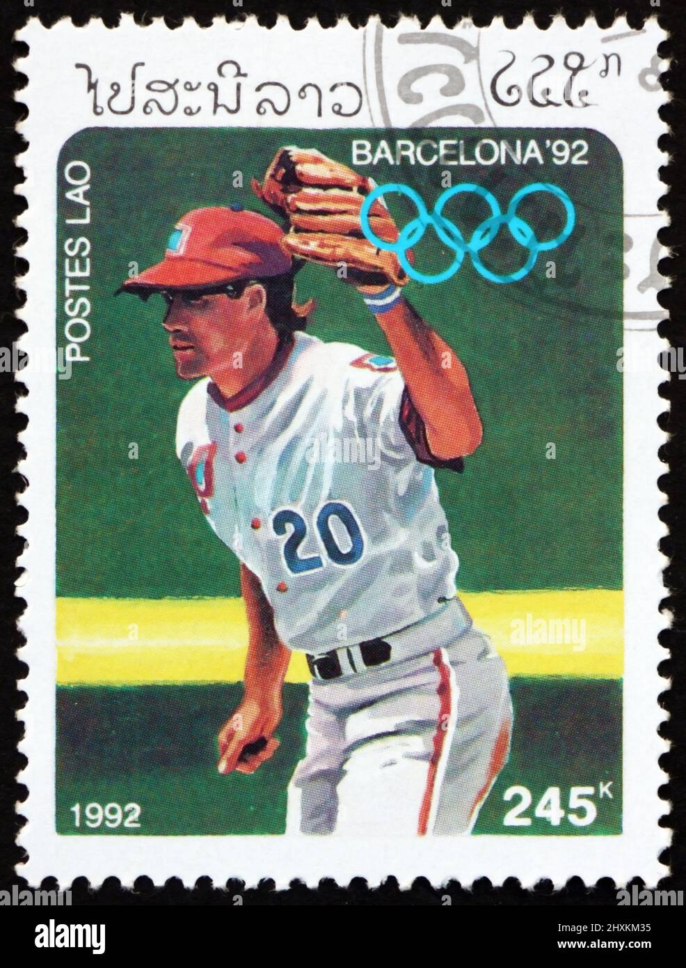LAOS - CIRCA 1992: a stamp printed in Laos shows baseball, 1992 Summer Olympics, Barcelona, circa 1992 Stock Photo