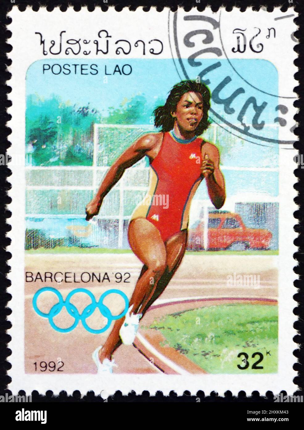 LAOS - CIRCA 1992: a stamp printed in Laos shows womens running, 1992 Summer Olympics, Barcelona, circa 1992 Stock Photo