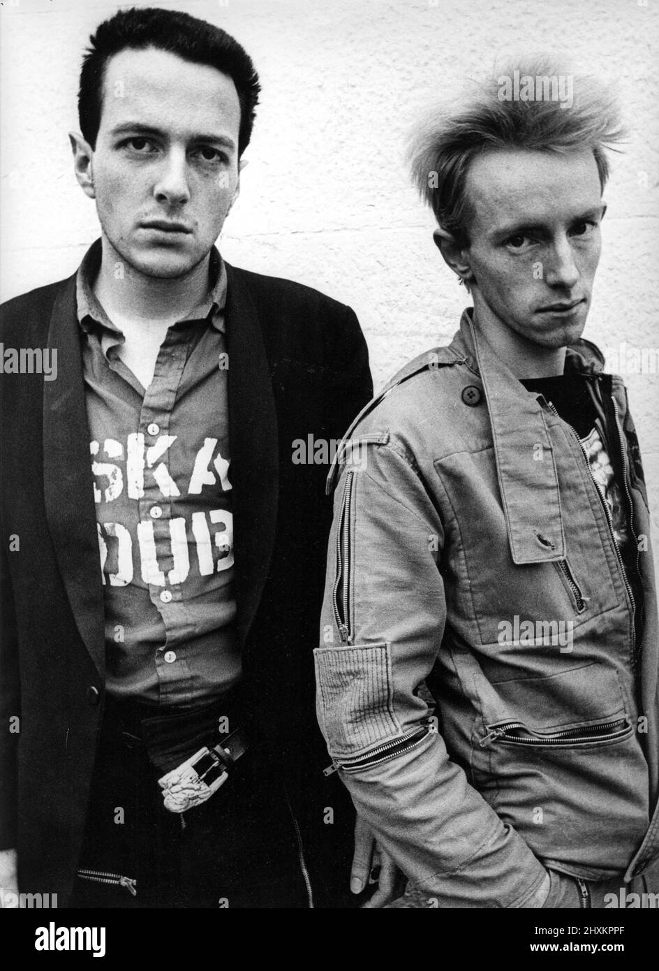 Joe Strummer (left) and Nicholas Headon members of the puck rock band The Clash after appearing in court at Morpeth today charged with theft from the Holiday Inn Hotel in Seaton Burn, North Tyneside 13 June 1977 Stock Photo