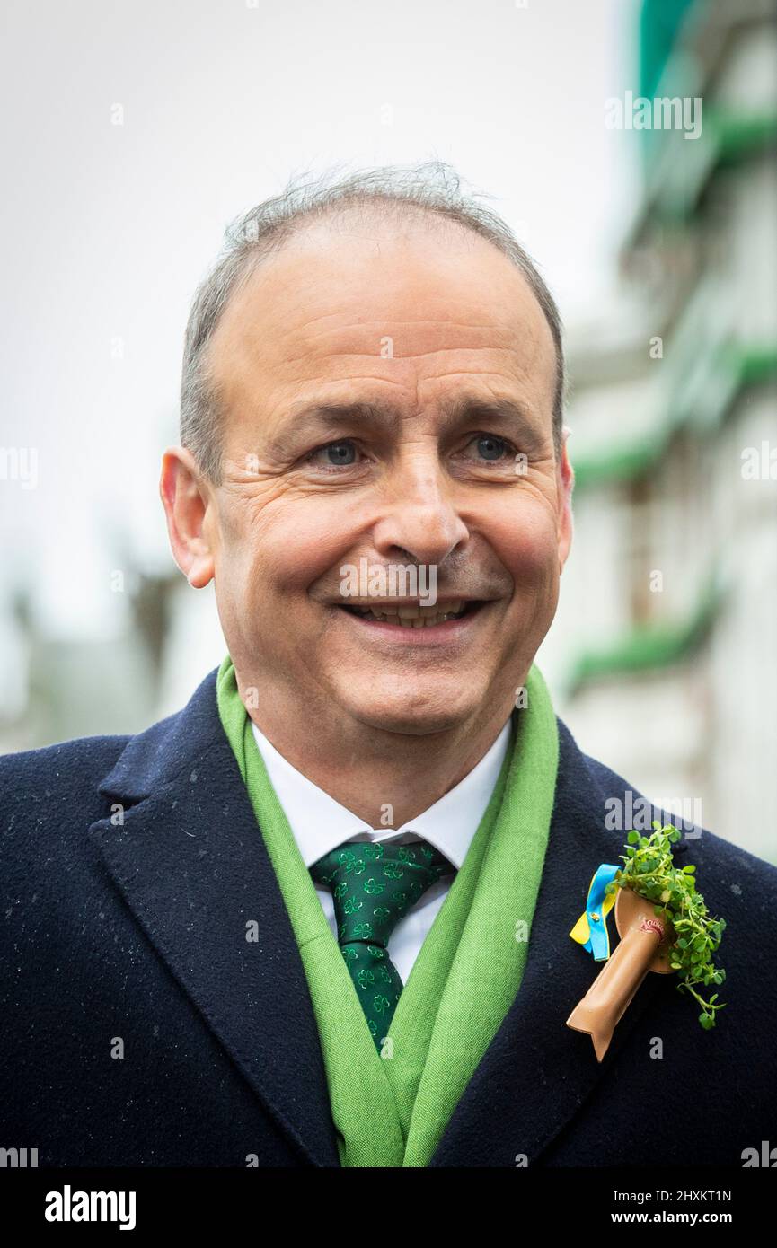 London, UK.  13 March 2022. Micheal Martin, current Taoiseach, at the head of the annual St Patrick’s Day parade in central London, which returns after being postponed due to the Covid-19 pandemic.  Key workers from across London are Grand Marshals at the event, in recognition of their work during the pandemic.  Credit: Stephen Chung / Alamy Live News Stock Photo