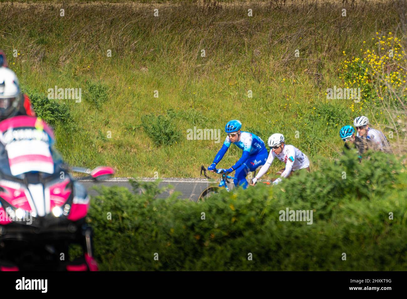 Italy, 12 March 2022 - professional cyclists travel an uphill road during the Tirreno Adriatico stage during the Apecchio - Carpegna stage in the Marc Stock Photo