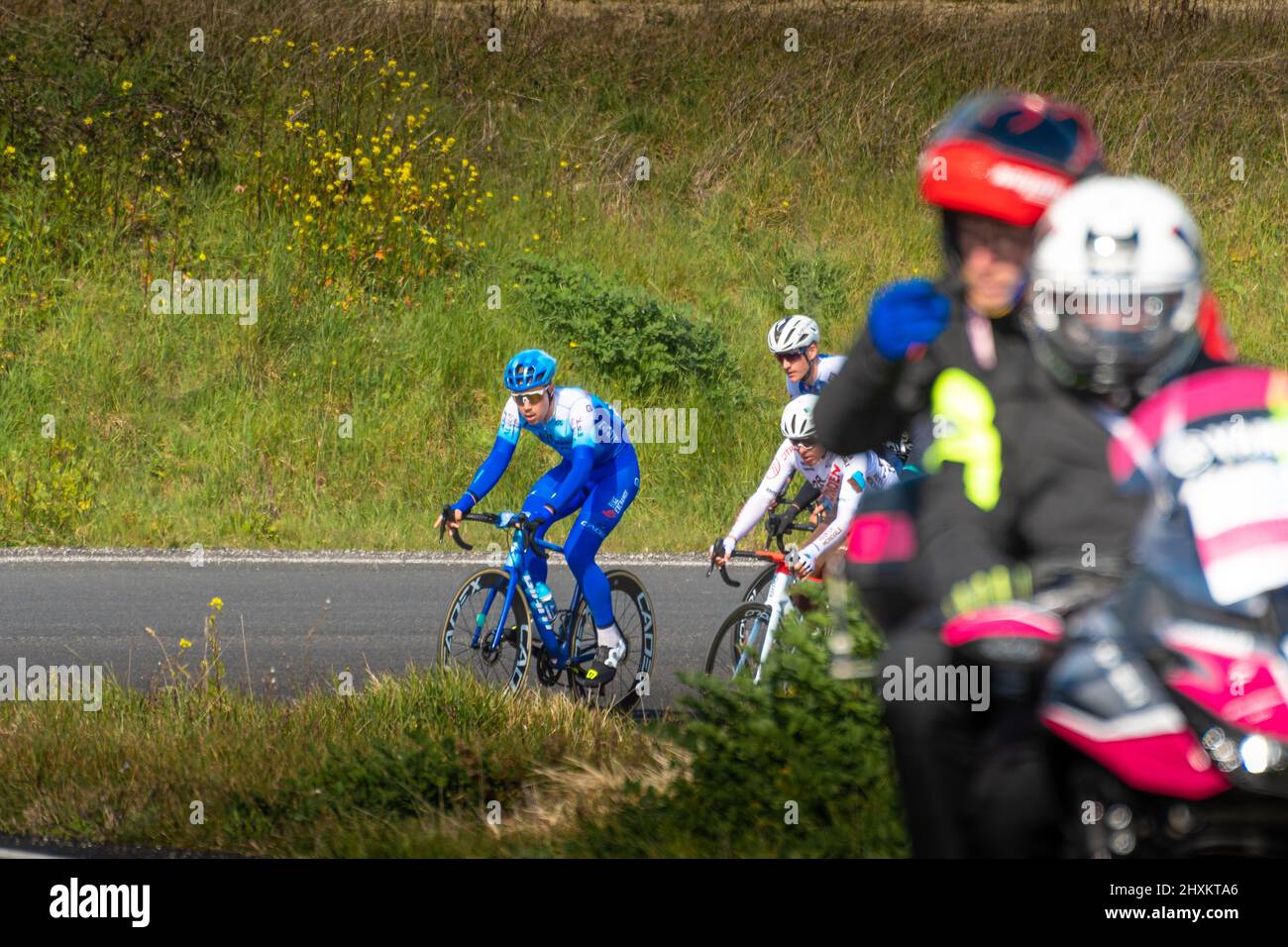 Italy, 12 March 2022 - professional cyclists travel an uphill road during the Tirreno Adriatico stage during the Apecchio - Carpegna stage in the Marc Stock Photo