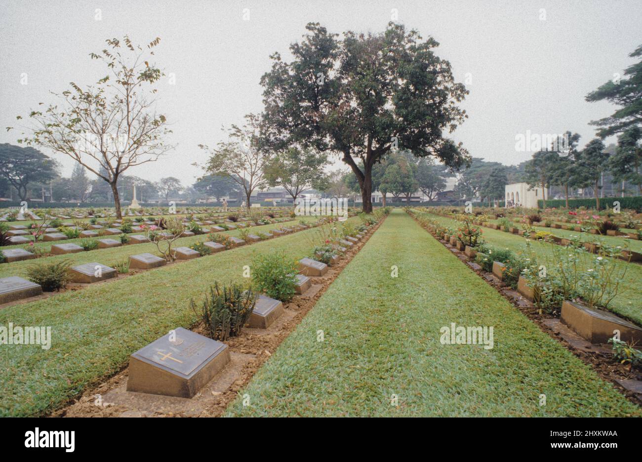 Gravestones at the Allied War Cemetery of Kanchanaburi that remember the British and Commonwealth victims of the Death Railway under Japanese occupation in Thailand. Stock Photo