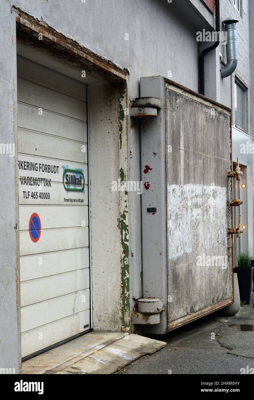 Old blast door on a city street in Bodo, Norway. Stock Photo