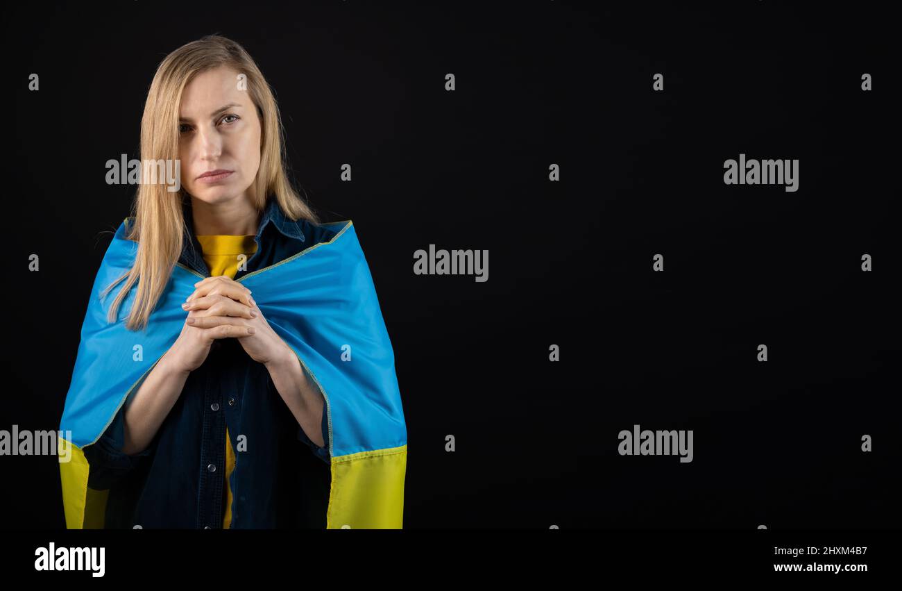 Woman holds ukrainian flag Stock Photo