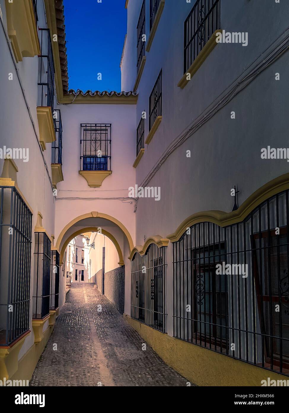 Ronda, Andalucia, Spain. Beautiful dreamy alley in the Old Town of Ronda city, in the Andalucia region, part of the famous White Villages. Stock Photo