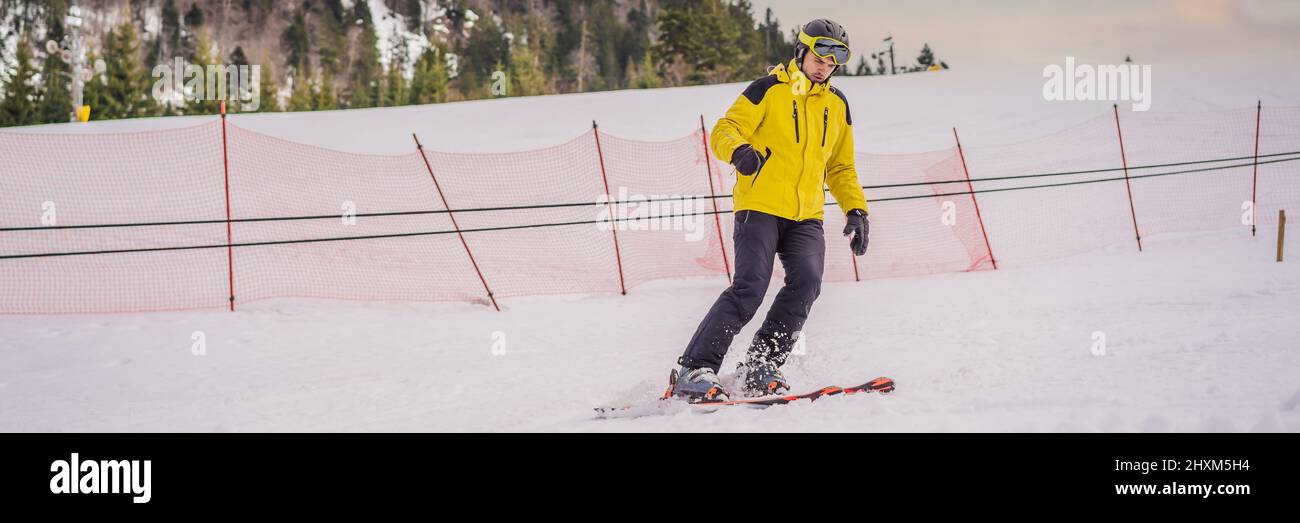 Ski instructor at training track showing students how to ski BANNER, LONG FORMAT Stock Photo