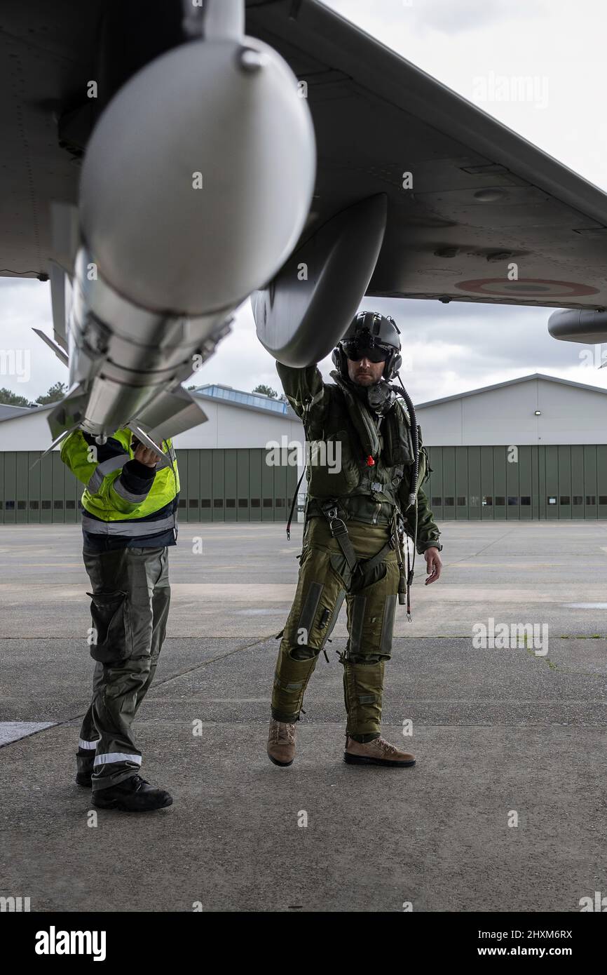 A French fighter pilot pre-flights his Rafale fighter jet at Mont-de-Marsan Air Base prior to launching on a Combat Air Patrol (CAP) mission over Poland. On February 24, the French Air Force began flying sorties over Poland, contributing to the security of the skies over the eastern part of the Alliance.  (Photo: NATO) Stock Photo