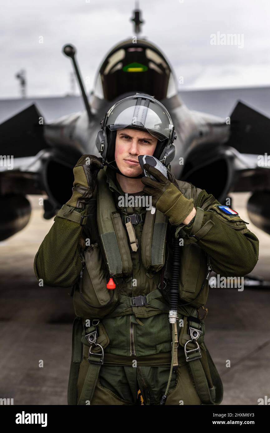 French Lieutenant “Balek” poses in front of his Rafale fighter jet at Mont-de-Marsan Air Base. On February 24, the French Air Force began flying sorties over Poland, contributing to the security of the skies over the eastern part of the Alliance.  (Photo: NATO) Stock Photo