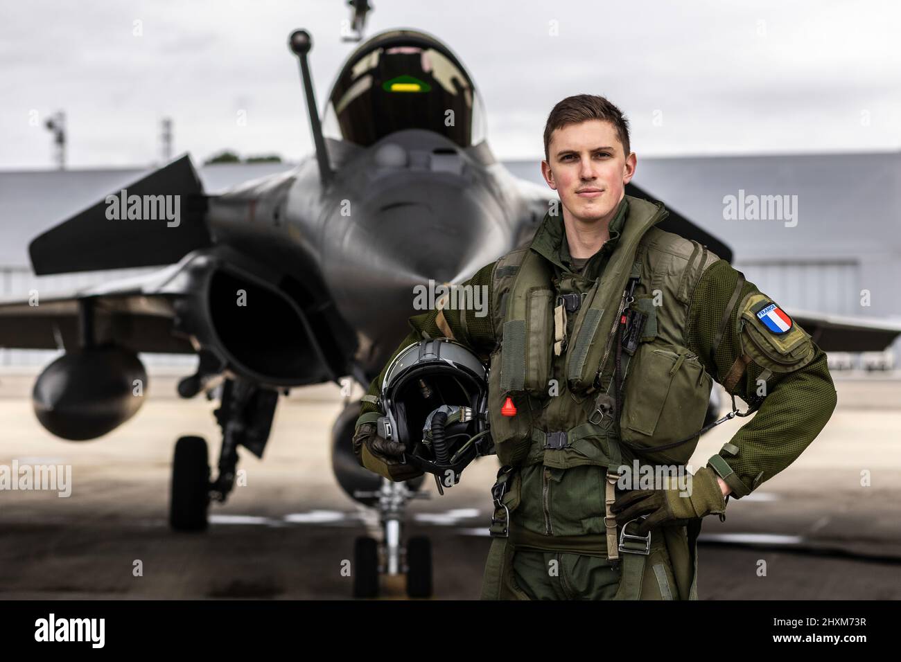 French Lieutenant “Balek” poses in front of his Rafale fighter jet at Mont-de-Marsan Air Base. On February 24, the French Air Force began flying sorties over Poland, contributing to the security of the skies over the eastern part of the Alliance.  (Photo: NATO) Stock Photo