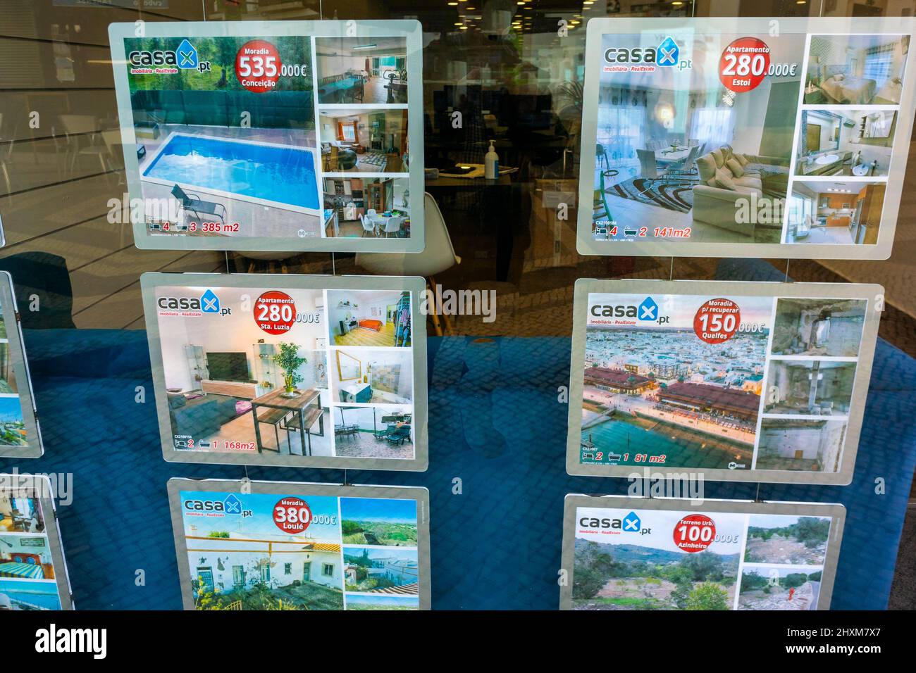 Faro, Portugal, Real Estate Agency Window with Houses for sale ads on