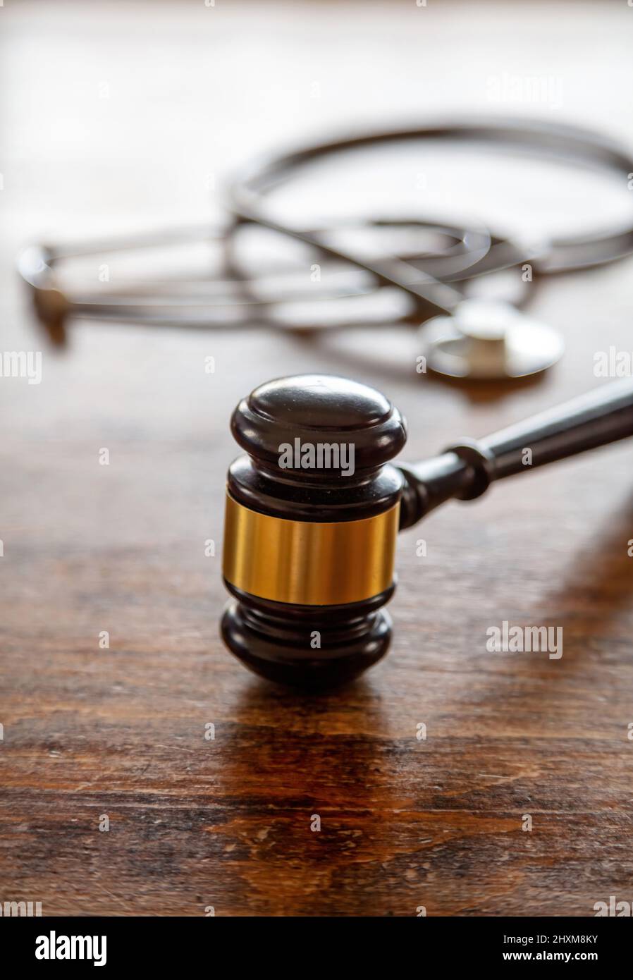 Personal injury attorney. Judge gavel and doctor stethoscope on lawyer