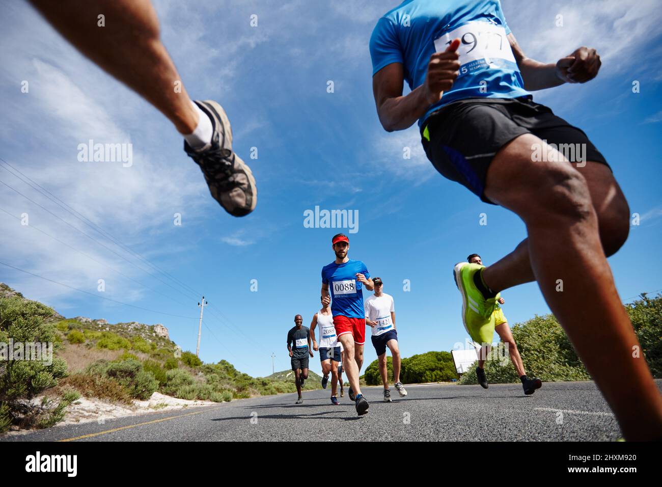Running fast and free. Low angle shot of a group of young men running a