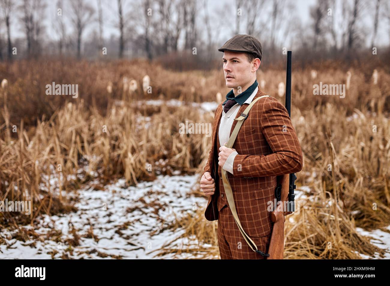 Confident caucasian hunter. American hunting rifles. Hunting