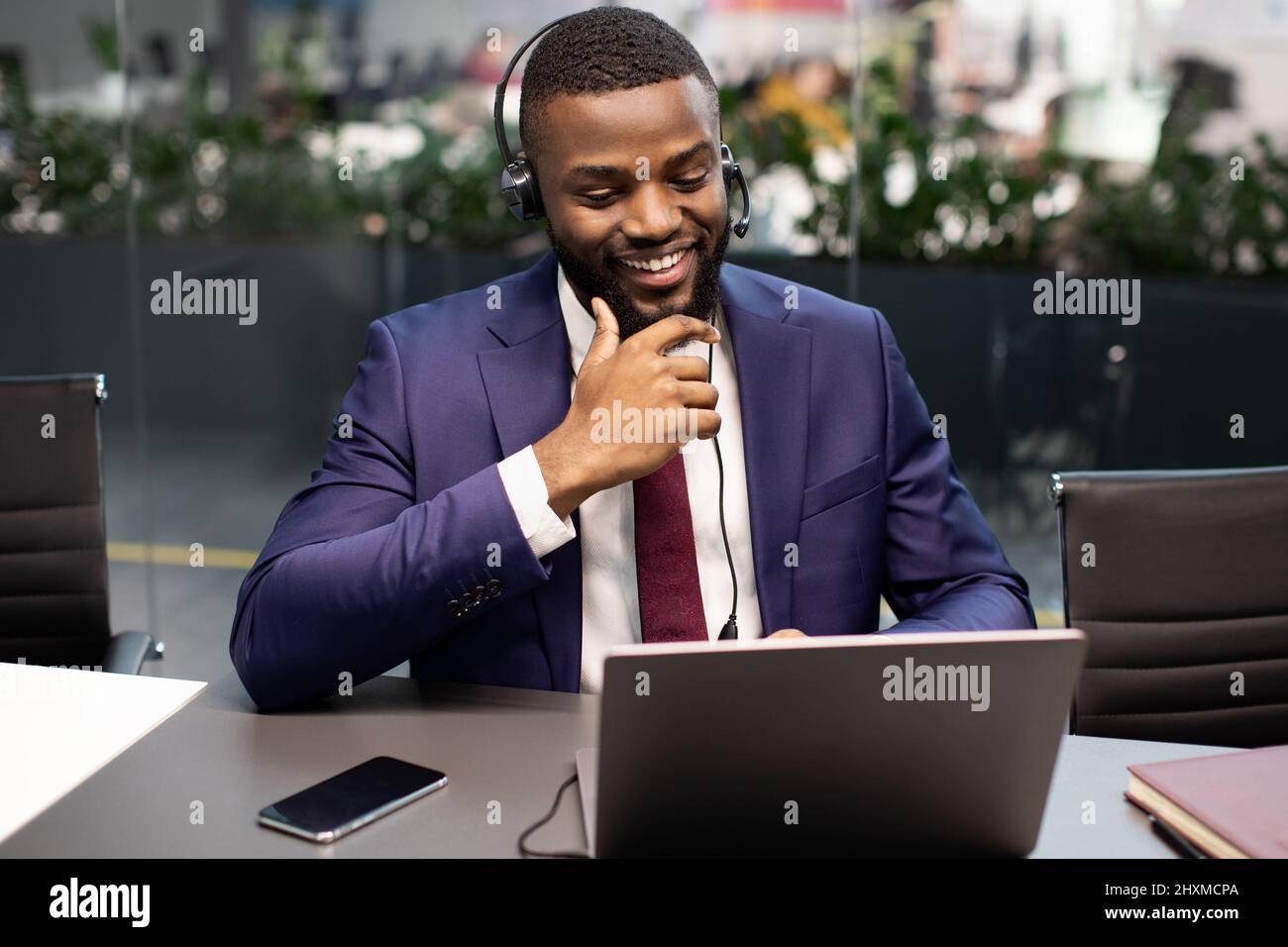 Handsome black manager having video interview with employee Stock Photo