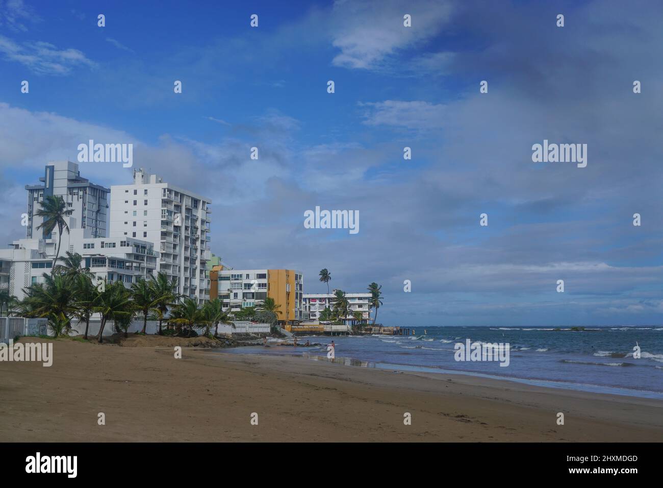Isla Verde Beach, Puerto Rico, USA: Palm trees and hotels on a beach in Puerto Rico. Stock Photo