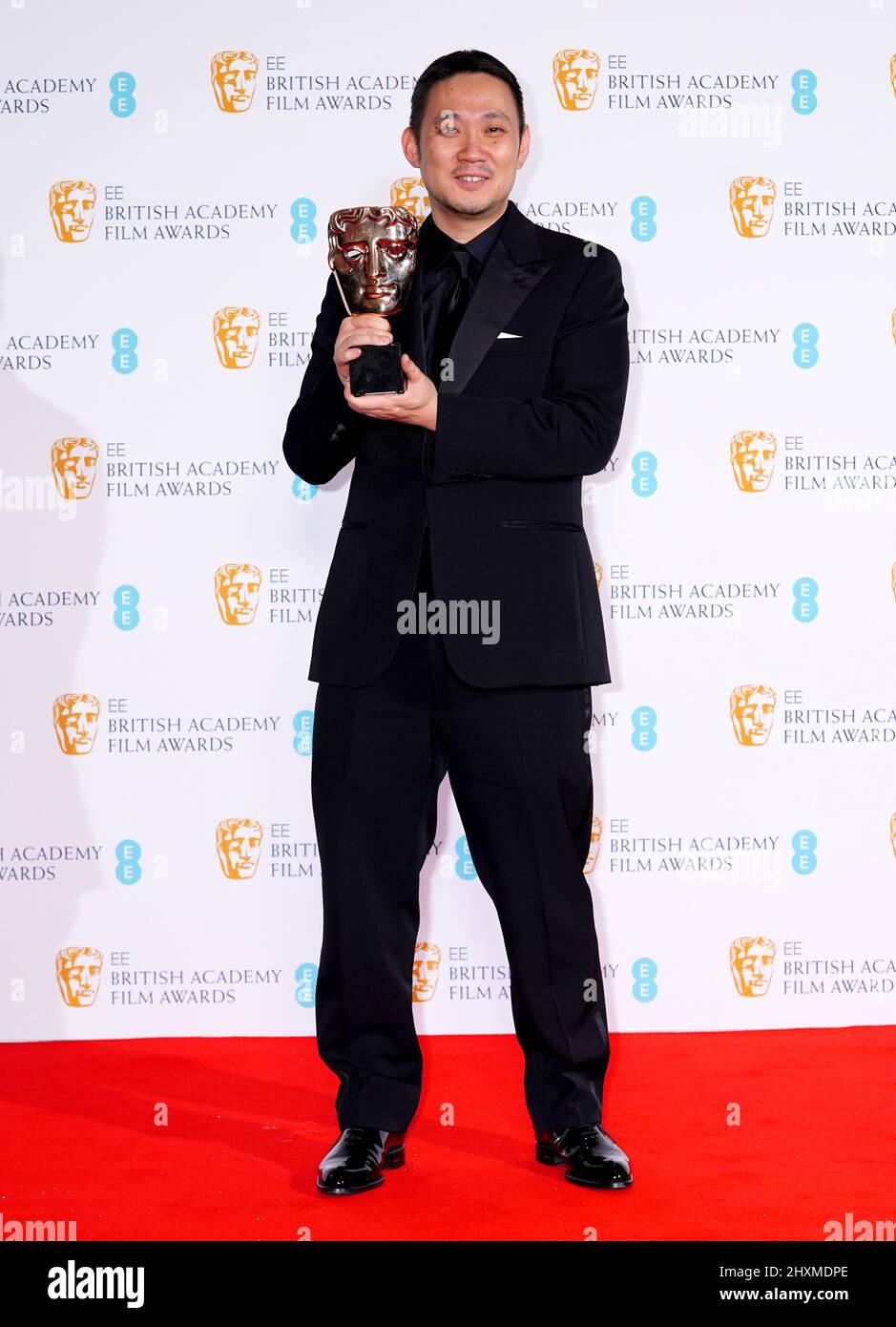 Ryusuke Hamaguchi in the press room after winning the Film Not In The English Language award for Drive My Car at the 75th British Academy Film Awards held at the Royal Albert Hall in London. Picture date: Sunday March 13, 2022. Stock Photo