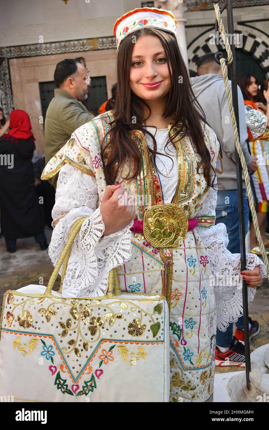 Tunis, Tunisia. 13th Mar, 2022. A Tunisian woman, dressed in traditional clothes takes part in a march during the National Day of Traditional Dress, organized by Tunisia Heritage Association in Tunis. Every year in March, Tunisians commemorate their history by wearing their traditional dress to ensure that their past is not forgotten. This year participants began the march from Madrasa Slimania towards the Statue of Ibn Khaldun. (Photo by Jdidi Wassim/SOPA Images/Sipa USA) Credit: Sipa USA/Alamy Live News Stock Photo