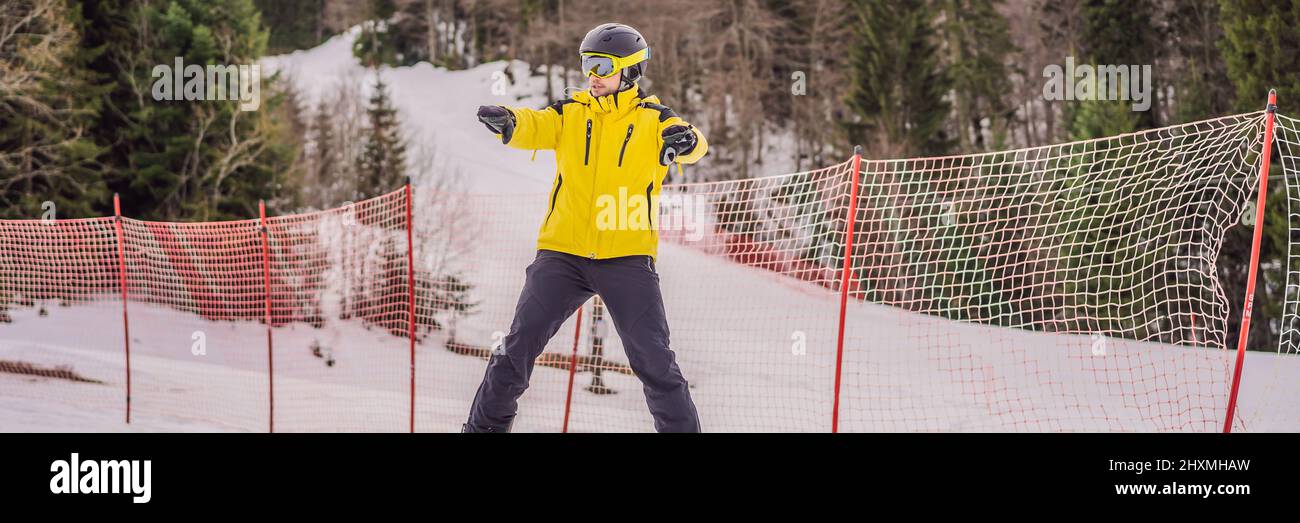 Ski instructor at training track showing students how to ski BANNER, LONG FORMAT Stock Photo