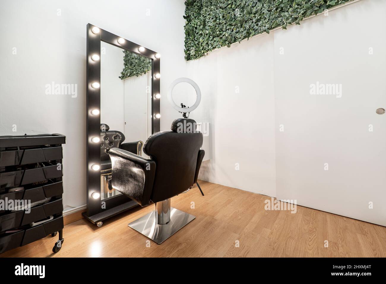 armchair in front of a mirror to make up and apply beauty treatments Stock Photo