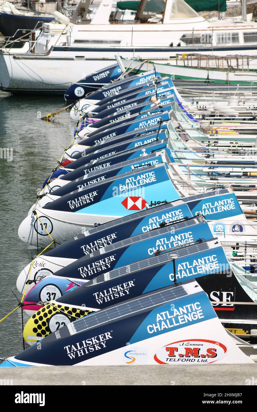 Rows of Atlantic Challenge Rowing boats awaiting transportation after